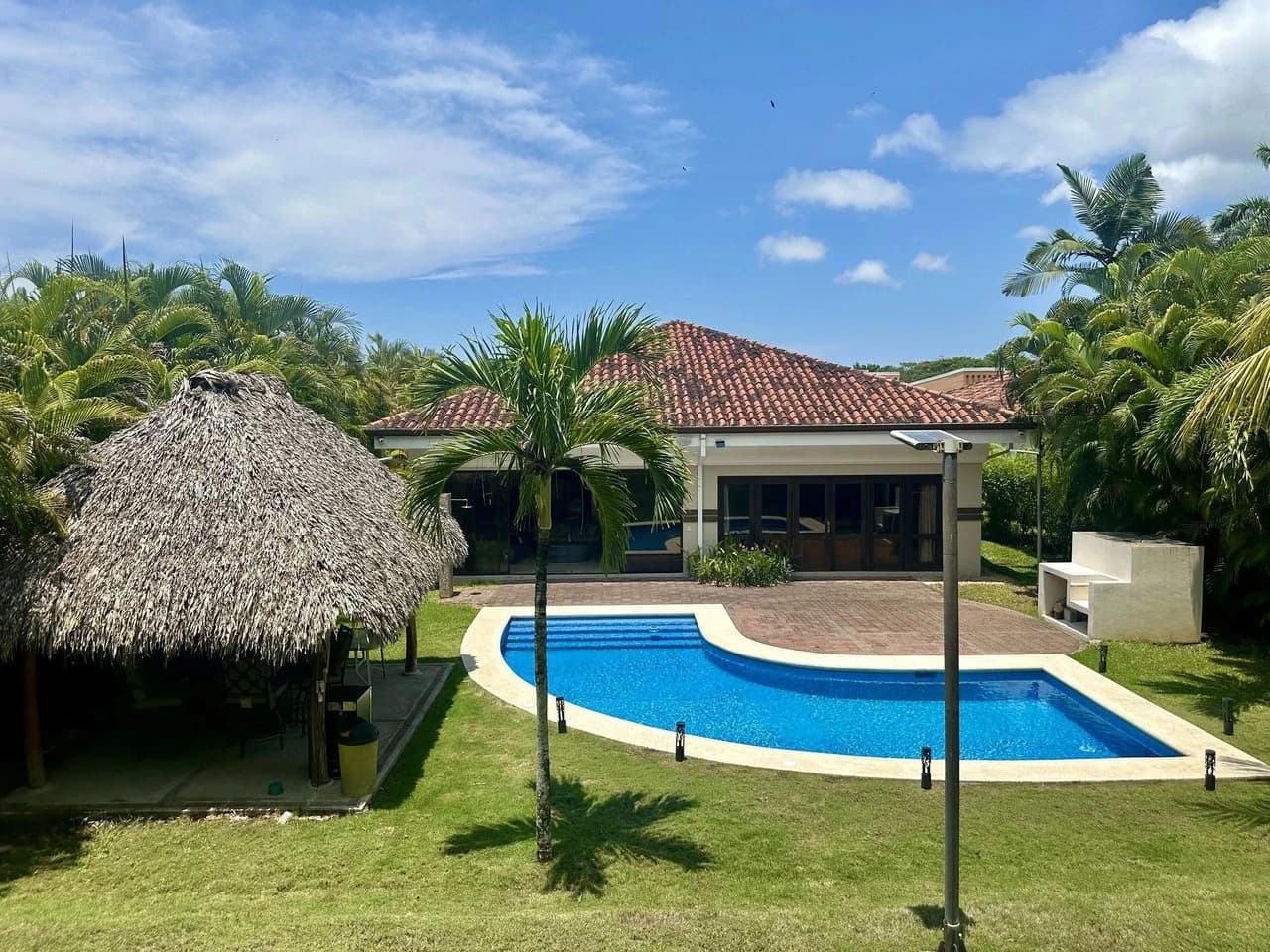 Villa 447: $599,000 USD Luxury NICOYA BAY HOME for sale on the Golf Course! Privacy, Tropical gardens, Fully Furnished, Beautiful views, Strong concrete block construction, High ceilings.......